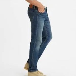 Levi’s 511, men’s or women’s blue jeans. Medium wash, 34/34